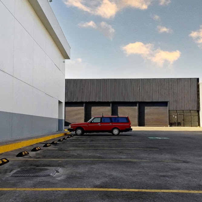 A commercial building are featuring Morristown Paving's asphalt paving work in Morris County, NJ. in the parking lot area. It demonstrates the smooth, durable asphalt surface and clear line striping essential for industrial facilities.